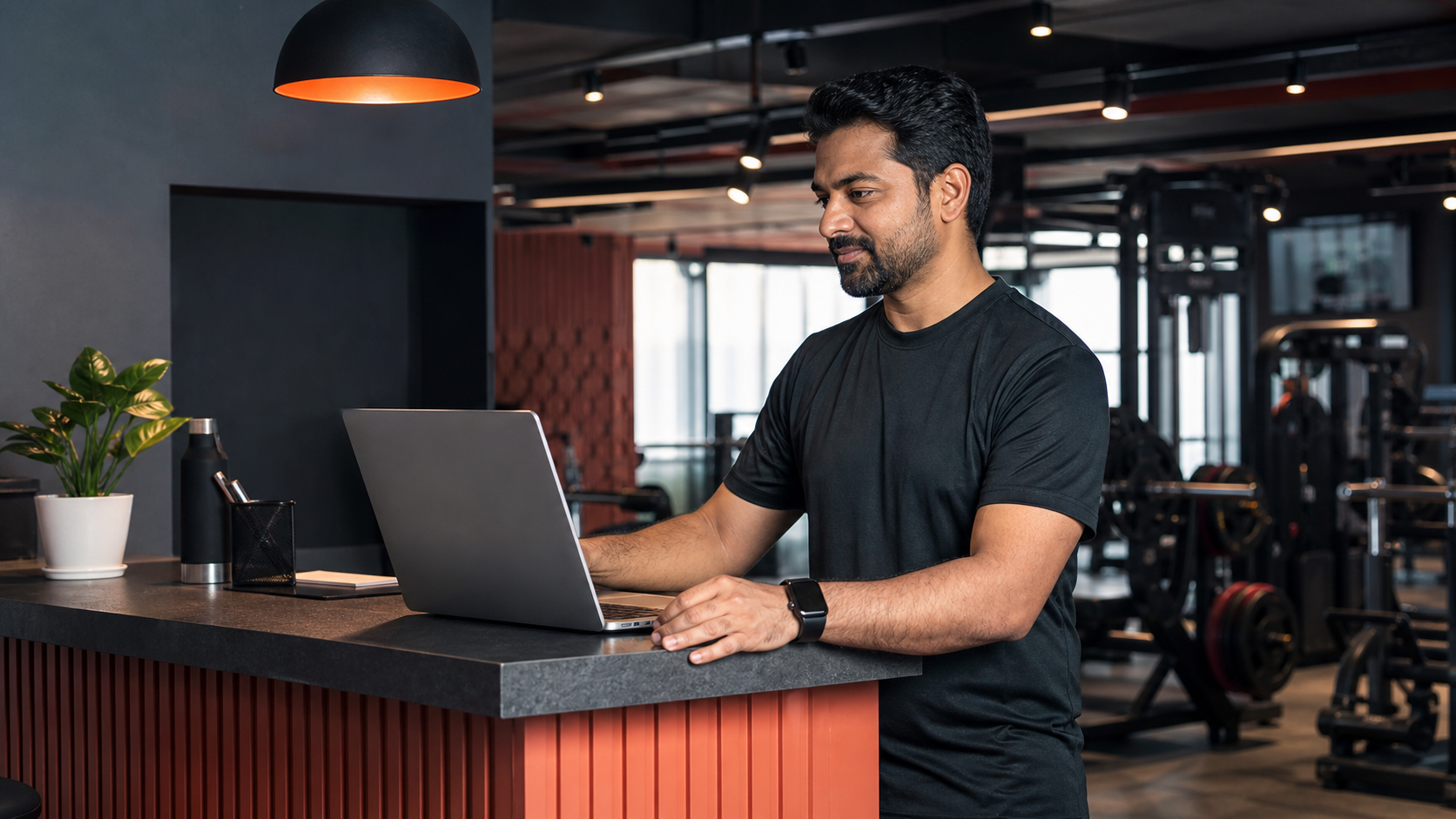 Gym owner reviewing membership and revenue data in MeetMyGym