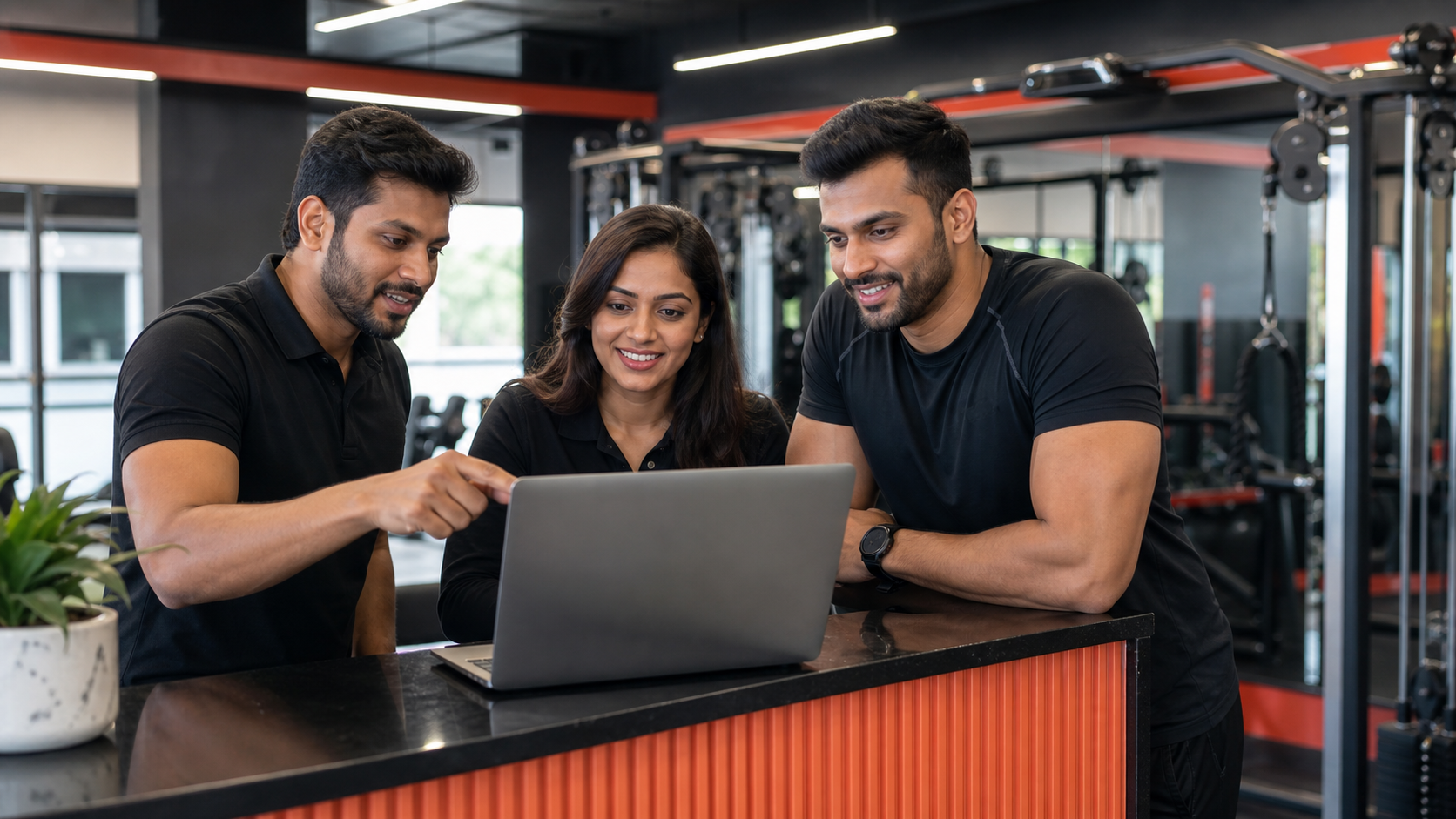 Gym staff learning a practical software workflow together